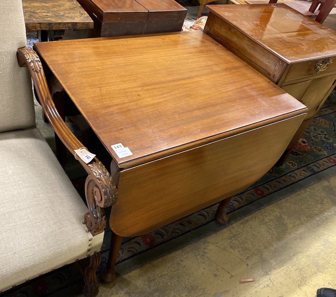 A 1920's mahogany drop flap dining table, width 83cm, depth 69cm, height 75cm
